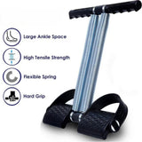Diagram of the Tummy Trimmer features: cushioned non-slip foot pedals and wide contoured foam handles for abdominal comfort.